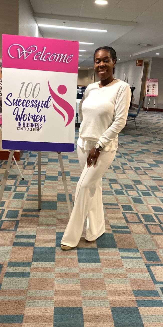 Jessica is taking a picture at the women success event